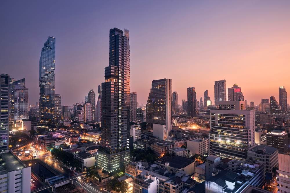 view of downtown Bangkok taken from atop a rooftop bar